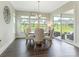 Cozy dining room featuring a round table, comfortable seating and large windows with backyard views at 1005 Willow Bank Ln, Belmont, NC 28012