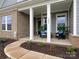 Inviting front porch with stylish seating, perfect for relaxing outdoors at 1005 Willow Bank Ln, Belmont, NC 28012