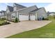 Spacious three-car garage and extra wide driveway at 1005 Willow Bank Ln, Belmont, NC 28012