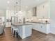 Modern kitchen with white cabinetry, a large center island with seating, and stainless steel appliances at 1005 Willow Bank Ln, Belmont, NC 28012