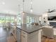 Open floor plan with an island kitchen, dining area, living room and sliding doors to the yard at 1005 Willow Bank Ln, Belmont, NC 28012