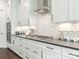 Beautiful kitchen with white cabinets, sleek countertops, and stainless steel appliances at 1005 Willow Bank Ln, Belmont, NC 28012