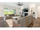 Comfortable living room featuring a fireplace, built-in shelves and sliding doors with backyard views at 1005 Willow Bank Ln, Belmont, NC 28012