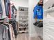 Organized walk-in closet with shelving and hanging space for clothing and shoes at 1005 Willow Bank Ln, Belmont, NC 28012