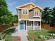 Charming two-story home with a welcoming porch and colorful flower garden, perfect for curb appeal at 102 Mobley St, Clover, SC 29710