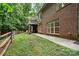 Lush backyard with a brick house, deck, and a fenced perimeter showcasing outdoor space at 10501 Olde Irongate Ln, Mint Hill, NC 28227
