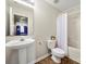 Standard bathroom featuring pedestal sink and a tiled shower with a curtain at 10501 Olde Irongate Ln, Mint Hill, NC 28227