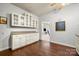 Kitchen featuring white cabinetry and granite countertops with hardwood floors at 10501 Olde Irongate Ln, Mint Hill, NC 28227