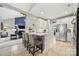 Bright, open kitchen with a large island, stainless steel appliances, and seamless flow into the living area at 10501 Olde Irongate Ln, Mint Hill, NC 28227