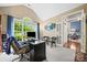 Bright office space with large window, desk, and seating area provides an inviting workspace at 10501 Olde Irongate Ln, Mint Hill, NC 28227