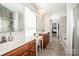Primary bathroom features dual vanities, a soaking tub, and a separate shower with glass doors at 107 Golden Valley Dr, Mooresville, NC 28115