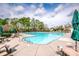Large community pool with surrounding seating area and umbrellas, perfect for relaxation and recreation at 107 Golden Valley Dr, Mooresville, NC 28115