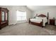 Inviting main bedroom with plenty of natural light, beautiful furniture and a calming atmosphere at 107 Golden Valley Dr, Mooresville, NC 28115