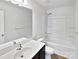Clean bathroom featuring a white vanity, bathtub, and a chrome shower head at 108 Greenway View Ct, Mount Holly, NC 28120