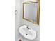 Bathroom with a white sink, golden mirror, chrome hardware, and tiled floors at 108 Greenway View Ct, Mount Holly, NC 28120