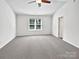 Large bedroom featuring neutral carpet, a ceiling fan and a window that provides ample light at 108 Greenway View Ct, Mount Holly, NC 28120