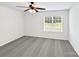 Bright, empty bedroom with gray carpet, white walls, ceiling fan and a window with blinds at 108 Greenway View Ct, Mount Holly, NC 28120