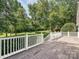 Enjoy the spacious back deck overlooking a serene, tree-filled backyard at 12029 Forest Home Dr, Fort Mill, SC 29708