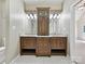Elegant bathroom with double vanity, granite counters, and stylish wood cabinets at 12029 Forest Home Dr, Fort Mill, SC 29708