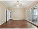 Bright bedroom featuring hardwood floors, and an adjoining door to a private patio at 12029 Forest Home Dr, Fort Mill, SC 29708