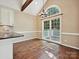 Dining room area with hardwood floors, natural light, chair rail, and access to a deck at 12029 Forest Home Dr, Fort Mill, SC 29708