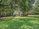 Sprawling front lawn with mature trees adding privacy and shade to this beautiful home at 12029 Forest Home Dr, Fort Mill, SC 29708