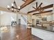 Open concept living area with hardwood floors, fireplace, stairs, and kitchen at 12029 Forest Home Dr, Fort Mill, SC 29708
