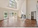 Open concept living area with hardwood floors, fireplace, and natural light at 12029 Forest Home Dr, Fort Mill, SC 29708
