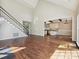 Open-concept living space with hardwood floors, high ceilings and stairs to upper level at 12029 Forest Home Dr, Fort Mill, SC 29708