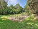 Spacious yard with a fenced area for gardening or other outdoor activities at 12029 Forest Home Dr, Fort Mill, SC 29708