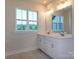 Bright bathroom features dual sinks, large mirror, and natural light at 123 Armstrong Rd, Belmont, NC 28012