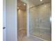 Modern bathroom with frameless glass shower and tiled surround at 123 Armstrong Rd, Belmont, NC 28012