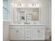 Bathroom featuring a double vanity with a large mirror, modern fixtures, and decor at 123 Armstrong Rd, Belmont, NC 28012