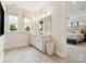 Modern bathroom with double vanity, large mirror, and view into the bedroom at 123 Armstrong Rd, Belmont, NC 28012