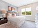 Bright bedroom features a large window, neutral decor, and stylish bedside lamps at 123 Armstrong Rd, Belmont, NC 28012