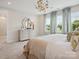 Light-filled bedroom featuring neutral colors, modern furnishings, and large windows with scenic views at 123 Armstrong Rd, Belmont, NC 28012