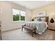 Inviting bedroom features a large window with a view, stylish decor, and neutral colors at 123 Armstrong Rd, Belmont, NC 28012