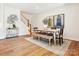 Well-lit dining room featuring decor, an area rug, and a staircase at 123 Armstrong Rd, Belmont, NC 28012