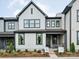 Charming two-story home with white siding, black trim, and a well-manicured front yard at 123 Armstrong Rd, Belmont, NC 28012