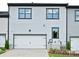 Exterior view of a modern home with a garage and well-maintained landscaping at 123 Armstrong Rd, Belmont, NC 28012