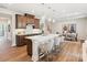 Bright kitchen features a large quartz island, stainless steel appliances, and pendant lighting at 123 Armstrong Rd, Belmont, NC 28012