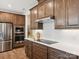 This kitchen features stainless steel appliances, white countertops, and dark brown cabinetry at 123 Armstrong Rd, Belmont, NC 28012