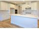 Modern kitchen features a large island, stainless steel appliances, and stylish pendant lighting at 123 Armstrong Rd, Belmont, NC 28012