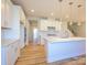 Spacious kitchen with a large island, stainless steel appliances, and white cabinets at 123 Armstrong Rd, Belmont, NC 28012