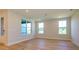 Living room with natural light, hardwood floors, and a view of the outdoors through large windows at 123 Armstrong Rd, Belmont, NC 28012