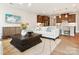 Open concept living space with a comfortable sofa and a view into the modern kitchen at 123 Armstrong Rd, Belmont, NC 28012