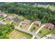 Aerial view showing a well-maintained street, lawn, and landscaping for the community at 137 Leaning Tower Dr, Mooresville, NC 28117
