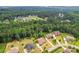 Beautiful aerial view of upscale homes in a lush, green community with mature trees at 137 Leaning Tower Dr, Mooresville, NC 28117