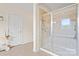 A bathroom offers a glass-enclosed shower with tiled walls and flooring, and bright natural lighting at 137 Leaning Tower Dr, Mooresville, NC 28117