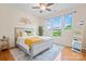 Serene bedroom with a comfortable bed, large windows, and stylish decor for a relaxing retreat at 137 Leaning Tower Dr, Mooresville, NC 28117